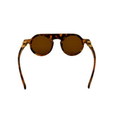 Sunglasses with tortoiseshell frame and brown lenses on a white background