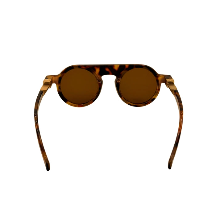 Sunglasses with tortoiseshell frame and brown lenses on a white background
