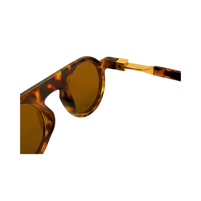 Sunglasses with tortoiseshell frame and brown lenses on a white background