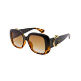 Sunglasses with tortoiseshell frame and brown lenses on a white background
