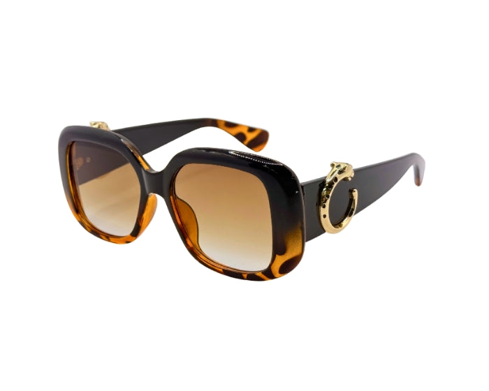 Sunglasses with tortoiseshell frame and brown lenses on a white background