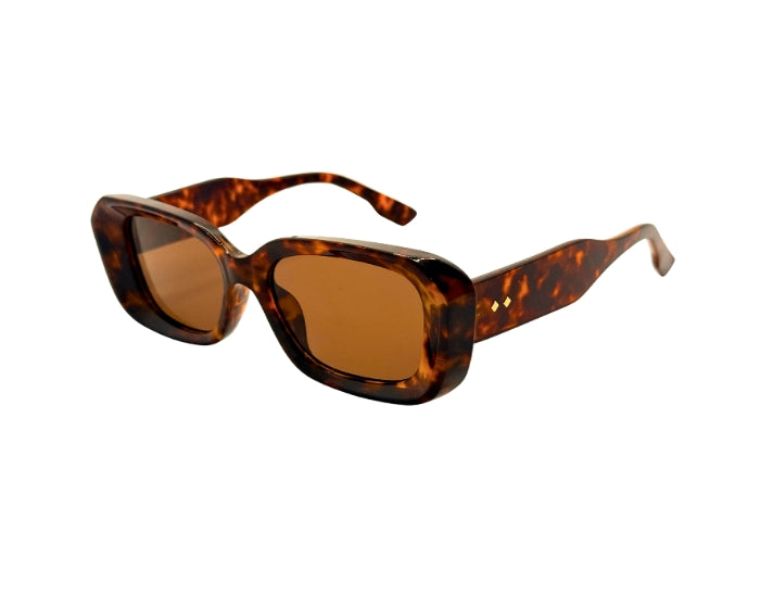 Sunglasses with tortoiseshell frame and brown lenses on a white background