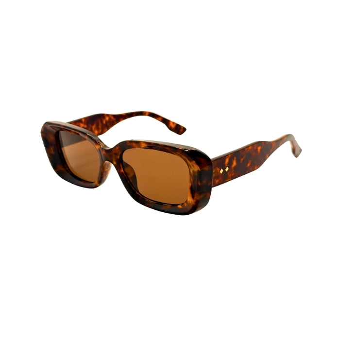 Sunglasses with tortoiseshell frame and brown lenses on a white background