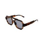 Sunglasses with tortoiseshell frame and dark lenses on a white background