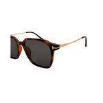 Sunglasses with tortoiseshell frame and dark lenses on a white background