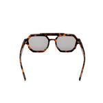 Sunglasses with tortoiseshell frame and reflective lenses on a white background