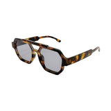 Sunglasses with tortoiseshell frame and reflective lenses on a white background