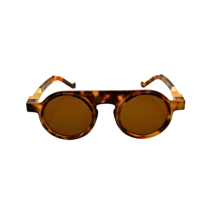 Tortoiseshell sunglasses with brown lenses on a white background