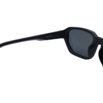 Black sunglasses with a dark lens on a white background
