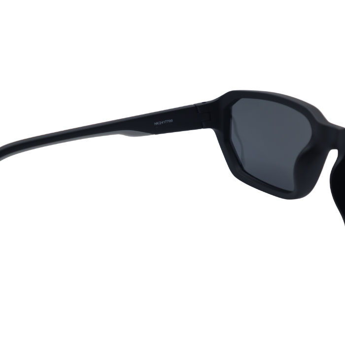 Black sunglasses with a dark lens on a white background