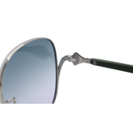 Sunglasses with a metallic frame and blue-tinted lenses on a white background