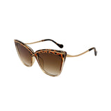 Cat-eye sunglasses with brown gradient lenses and gold frame on a white background