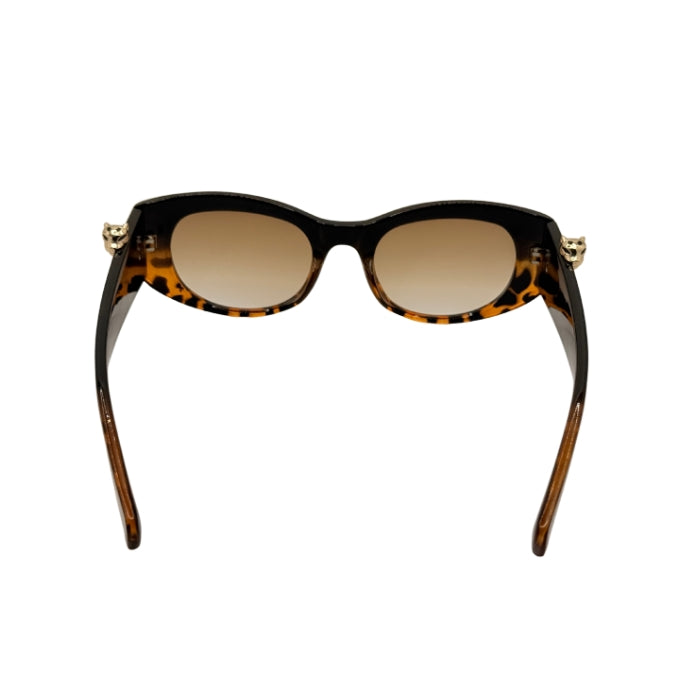 Sunglasses with tortoiseshell frame and brown lenses on a white background