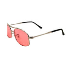Sunglasses with pink lenses and gold frames on a white background