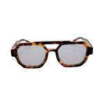Sunglasses with tortoiseshell frame and reflective lenses on a white background